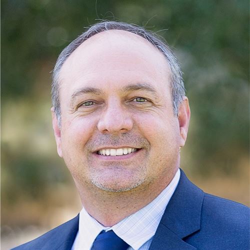 Smiling man in a blue suit